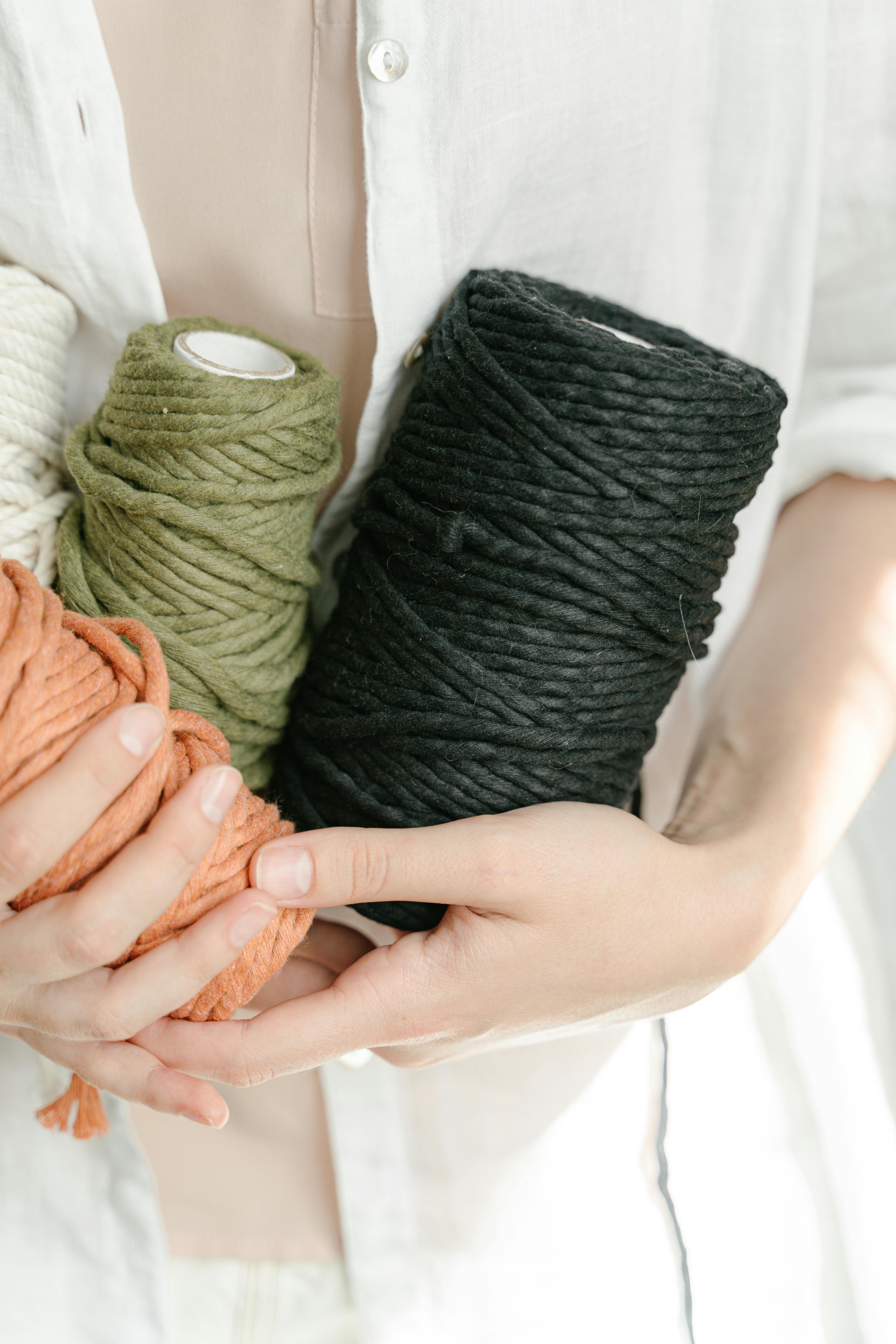 holding light green yarn and light green yarn